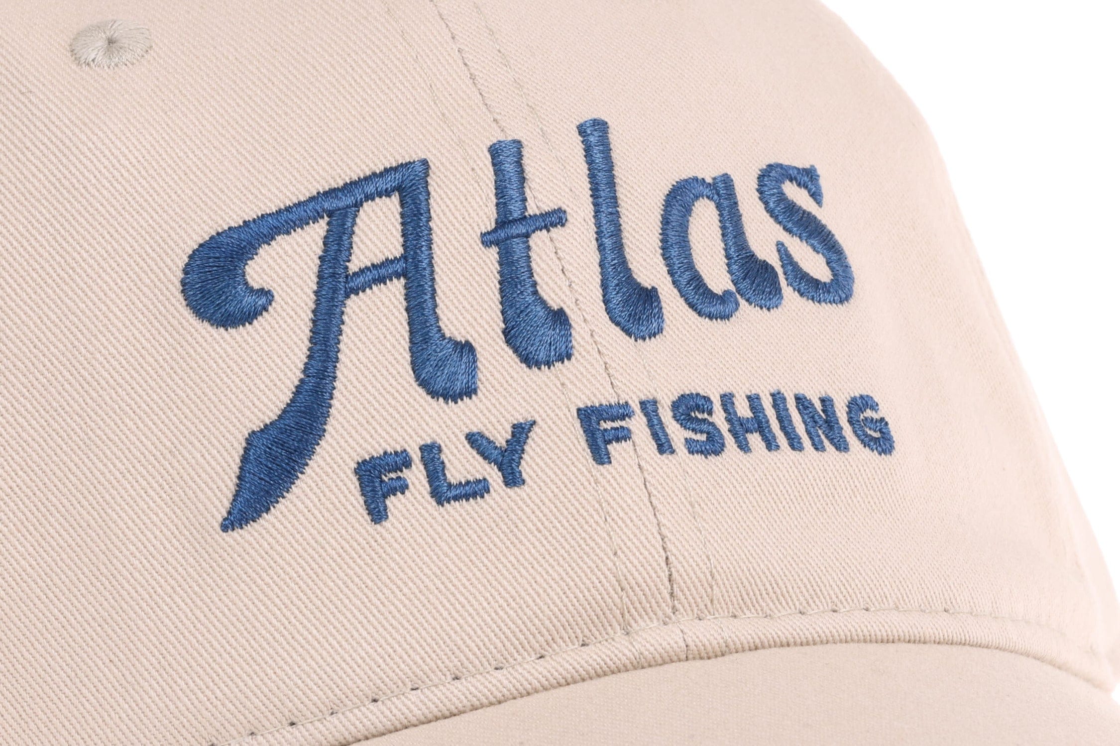Beige cotton twill baseball hat with blue embroidered Atlas script and Fly Fishing logo