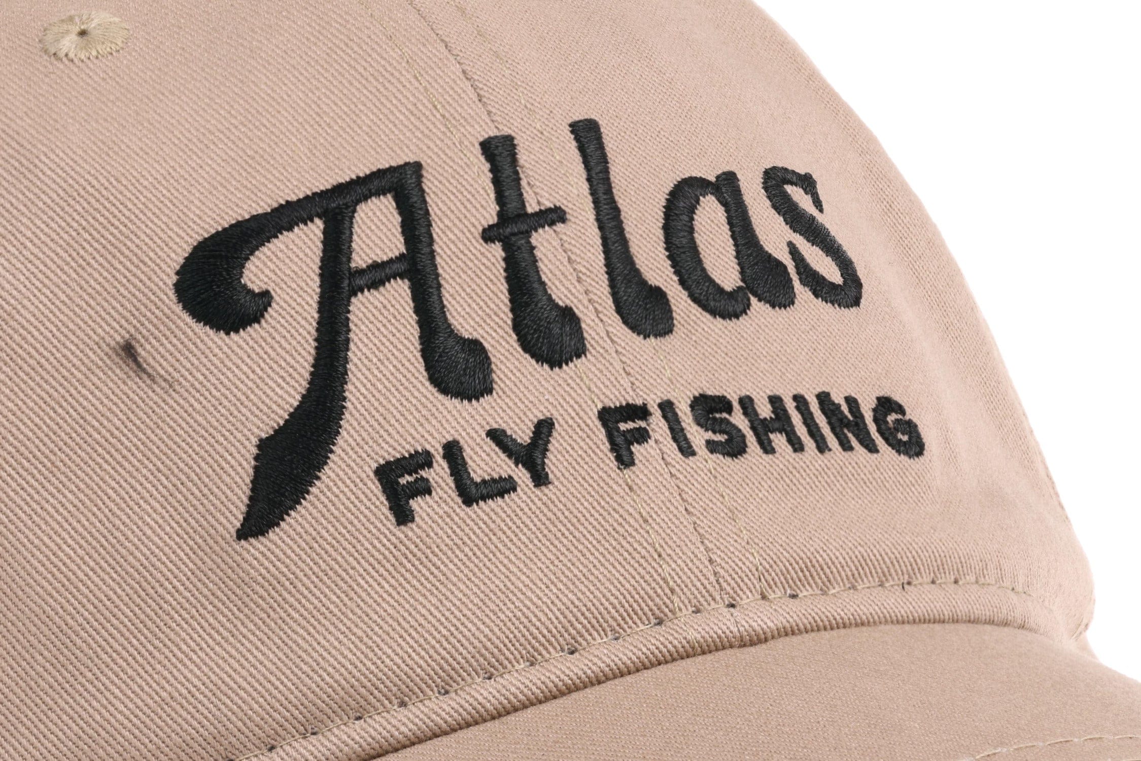 Beige cotton twill embroidered hat with black Atlas script and FLY FISHING text, curved brim and stitched panel detail