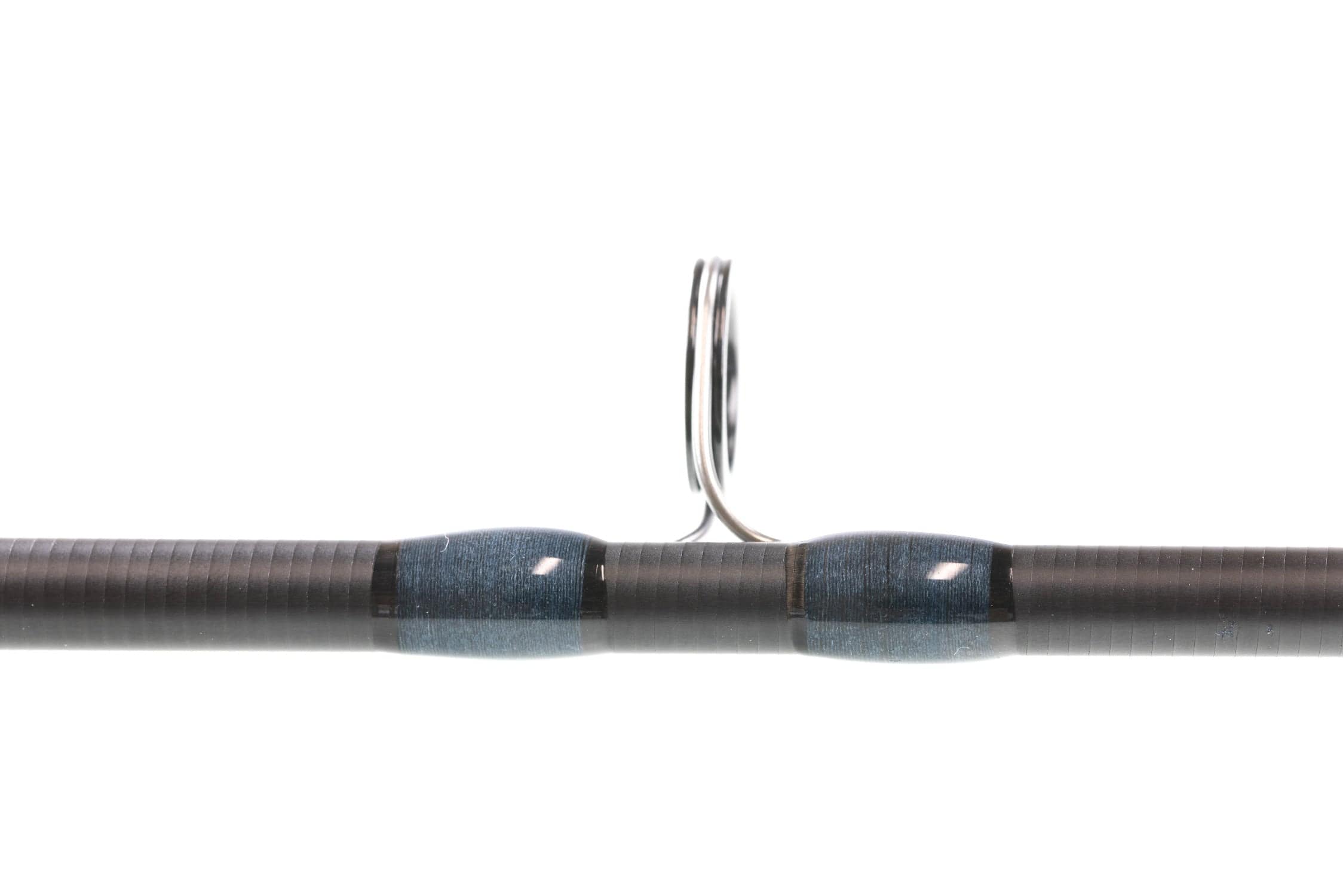 Atlas Signature 9ft 8wt fly rod close-up of black graphite blank with blue thread wraps and stainless guide ring