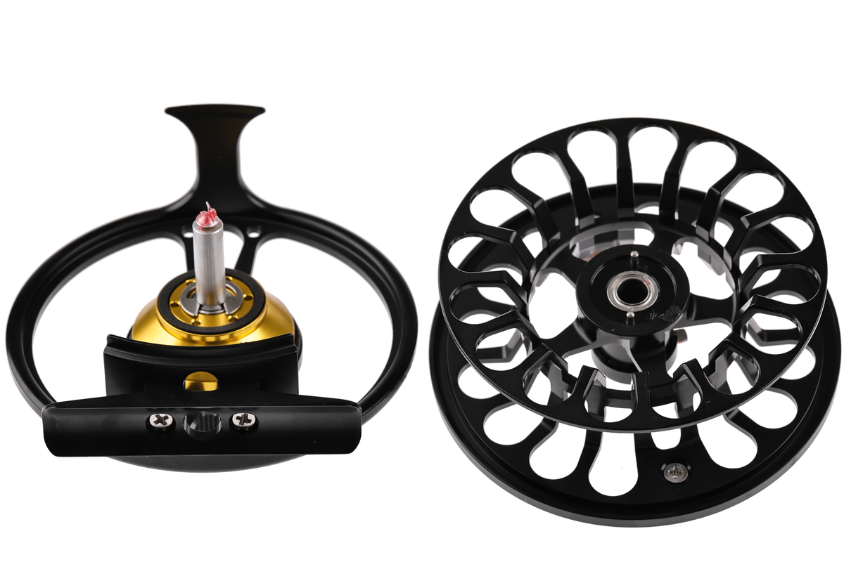 Bauer RX fly reel with black anodized aluminum large-arbor spool and gold machined center, vented cage design