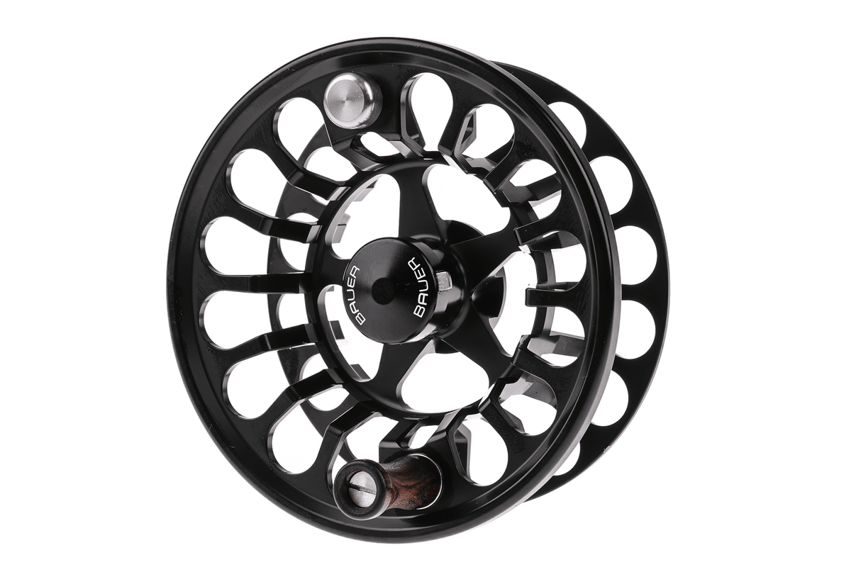 Matte black anodized aluminum Bauer RX fly reel with large-arbor cutout spoke design and wooden handle knob