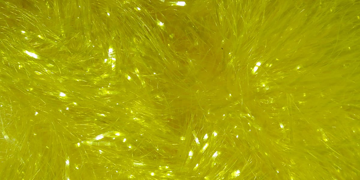 Bright chartreuse yellow sparkly synthetic chenille with iridescent flash fibers, fluffy fly tying material