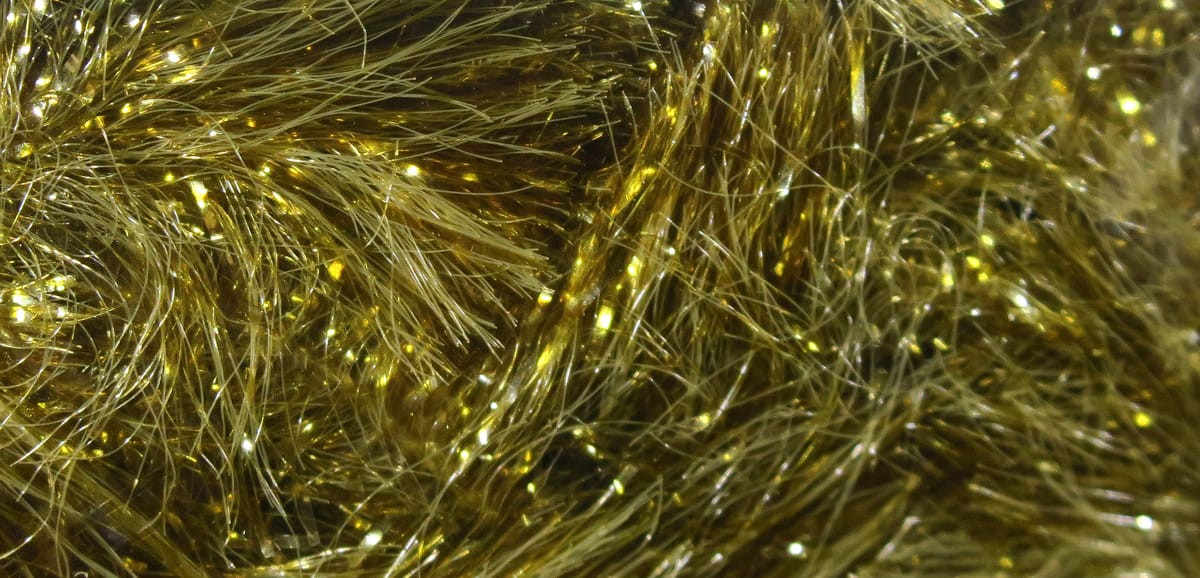 Olive-gold Gamechanger chenille with sparkling tinsel fibers and plush synthetic strands for fly tying