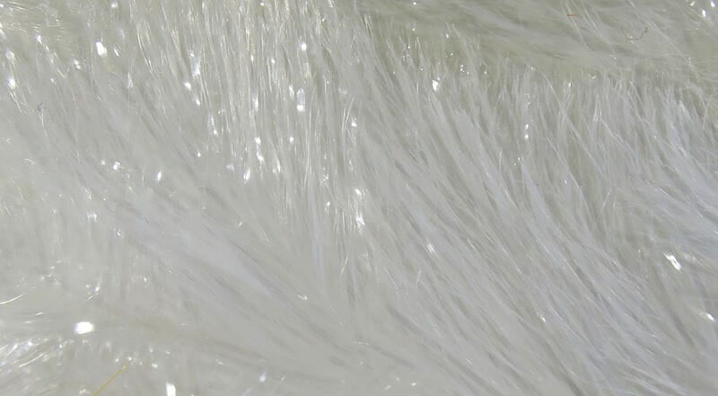 White iridescent synthetic chenille with long fluffy fibers and subtle sparkle, fly tying material