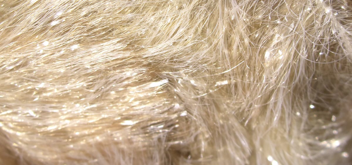 Champagne blonde Chockletts Gamechanger chenille with fine sparkly synthetic fibers for fly tying