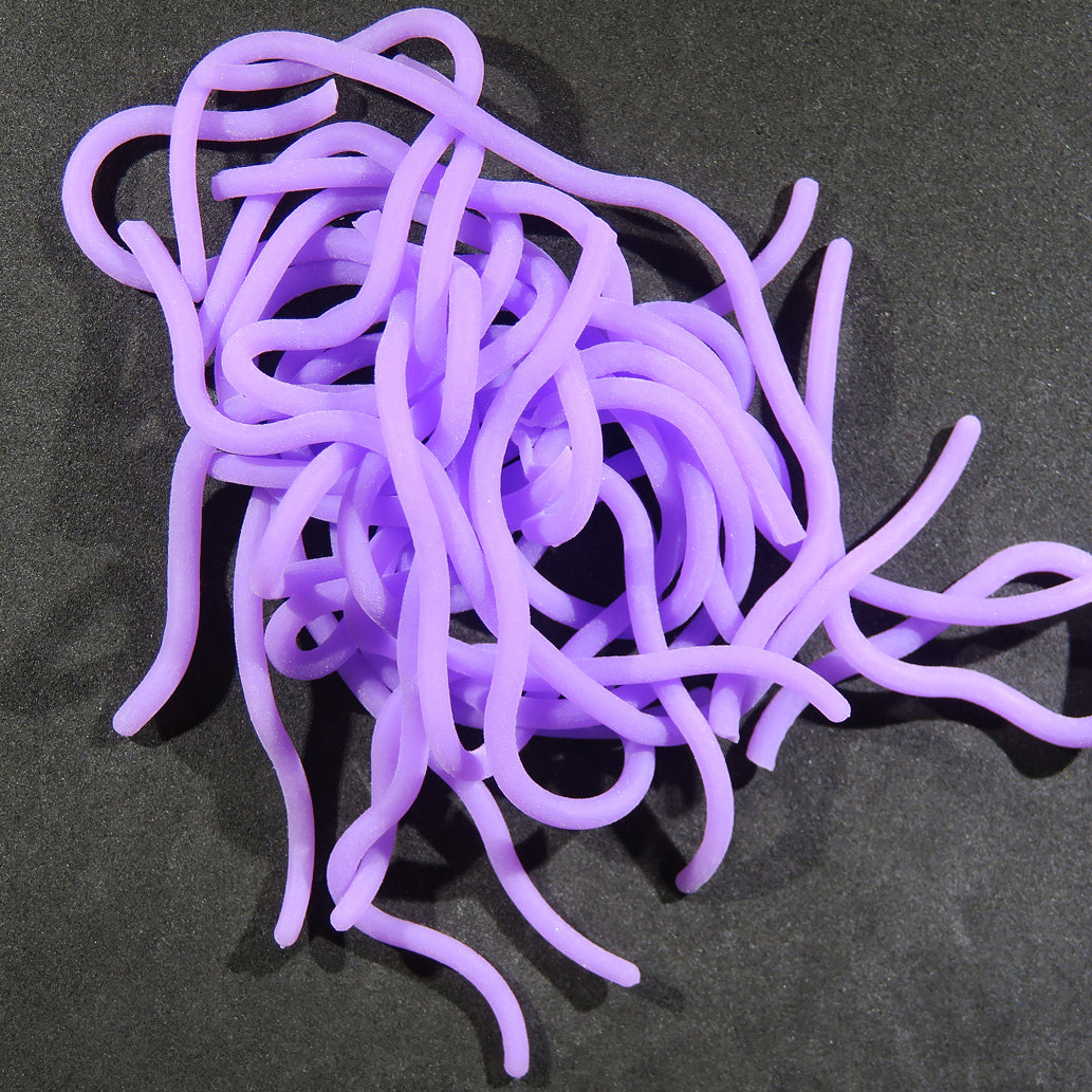 Bright purple silicone squirmy worm strands for fly tying, soft tubular lure material