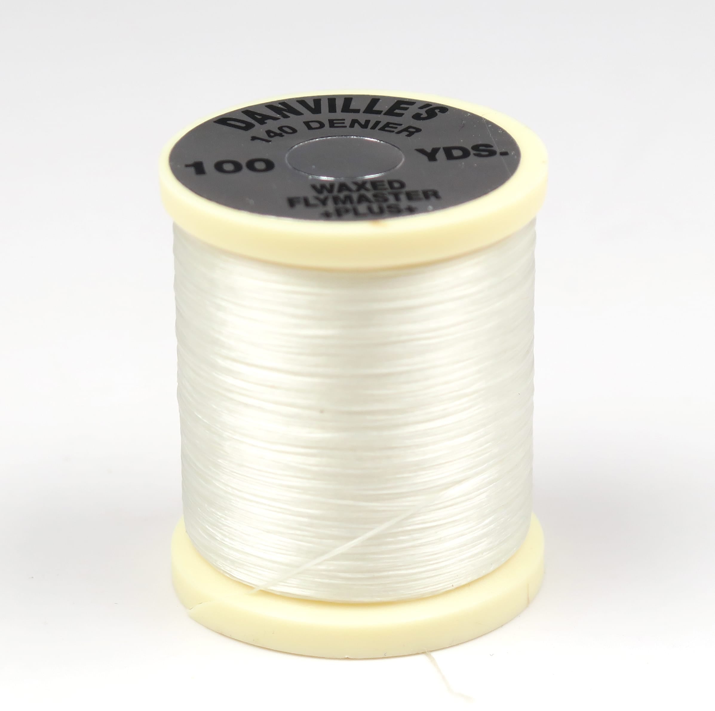Danville waxed fly-tying thread spool, translucent off-white 140 denier wrapped on cream plastic core with black label