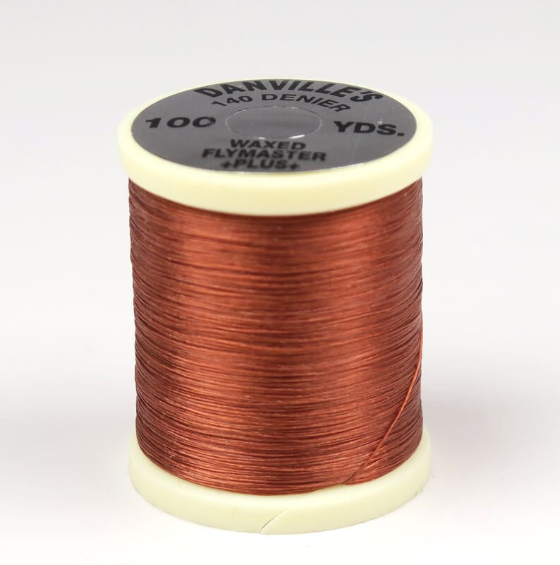 Danville waxed Flymaster Plus copper 140 denier fly tying thread on cream plastic spool, smooth glossy finish