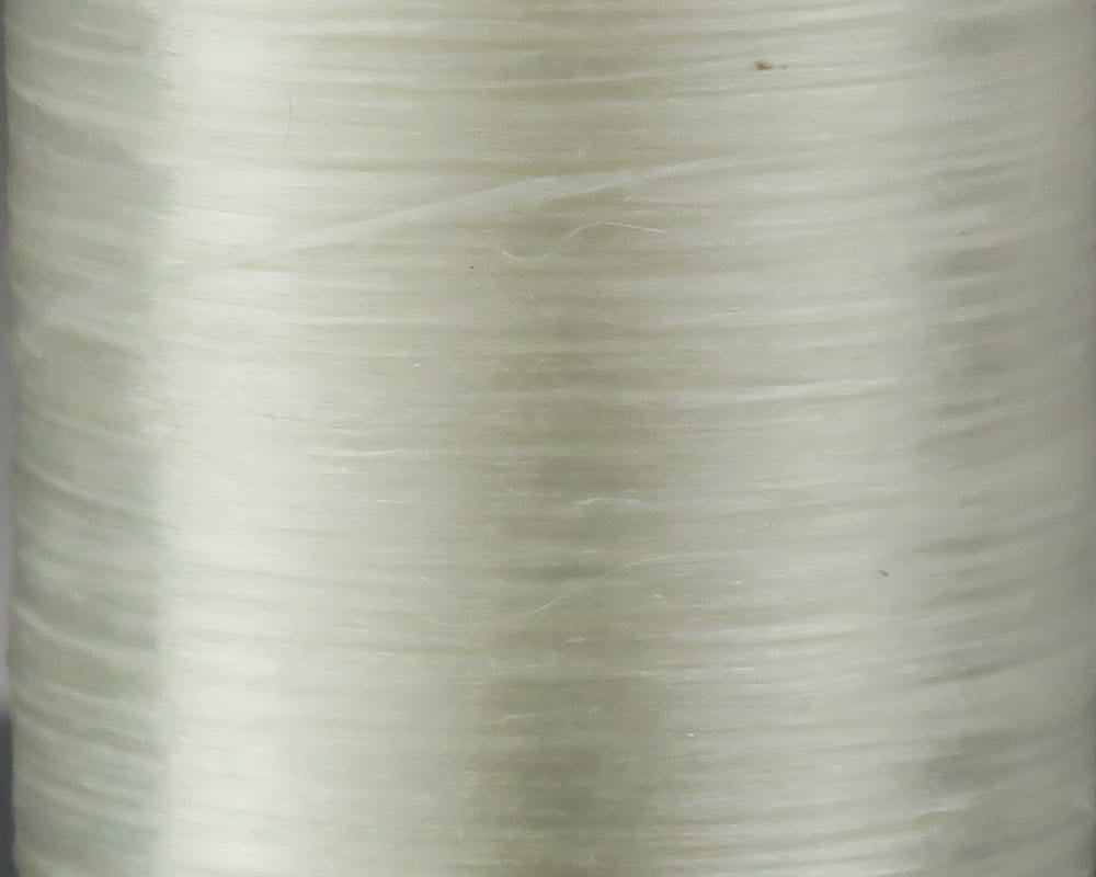 Cream-white Danville 210 denier flat waxed thread spool with smooth glossy nylon texture for fly tying