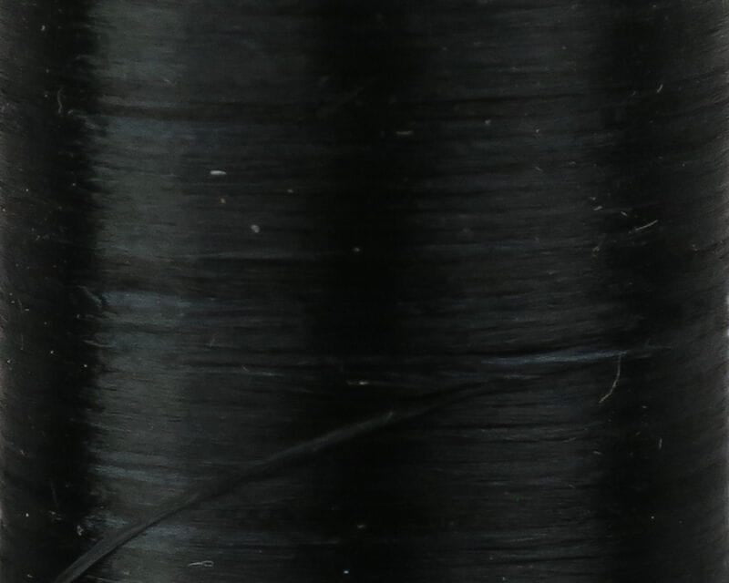 Close-up of black Danville 210 denier flat waxed thread spool, smooth waxed polyester for fly tying