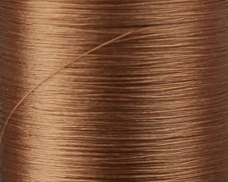 Copper brown Danville Flymaster fly tying thread close-up showing fine 6/0 synthetic sheen and wrapped spool texture