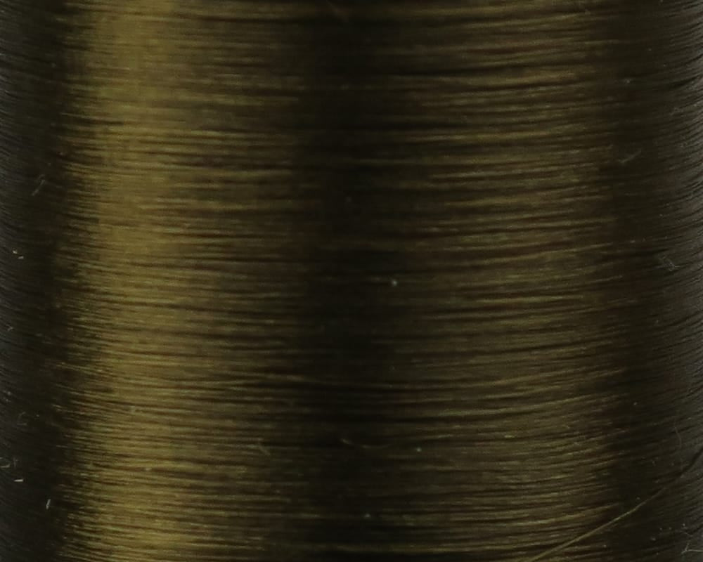 Olive-brown Danville Flymaster 6/0 nylon thread spool, close-up showing smooth, fine, shiny fly tying thread