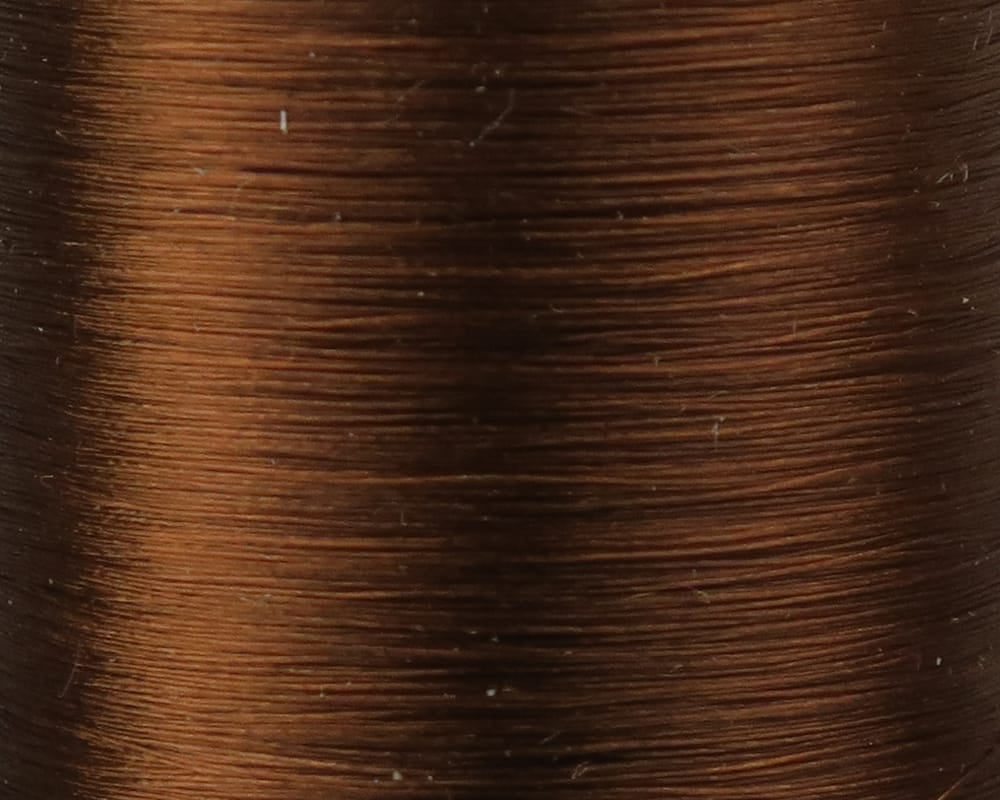 Close-up spool of Danville Flymaster 6/0 70 denier brown glossy synthetic fly tying thread