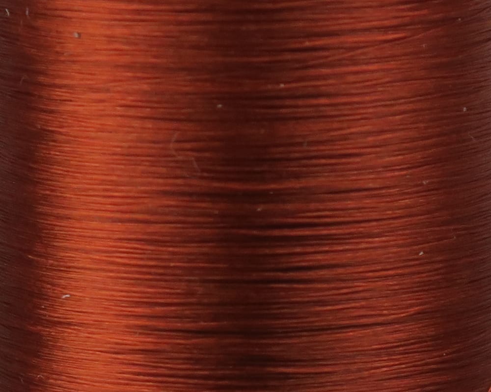 Copper brown Danville Flymaster 6/0 fly tying thread spool close-up showing smooth glossy synthetic thread wraps