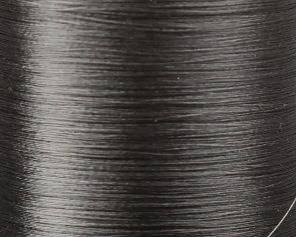Danville Flymaster 6/0 70 denier dark gray nylon fly tying thread on smooth glossy spool