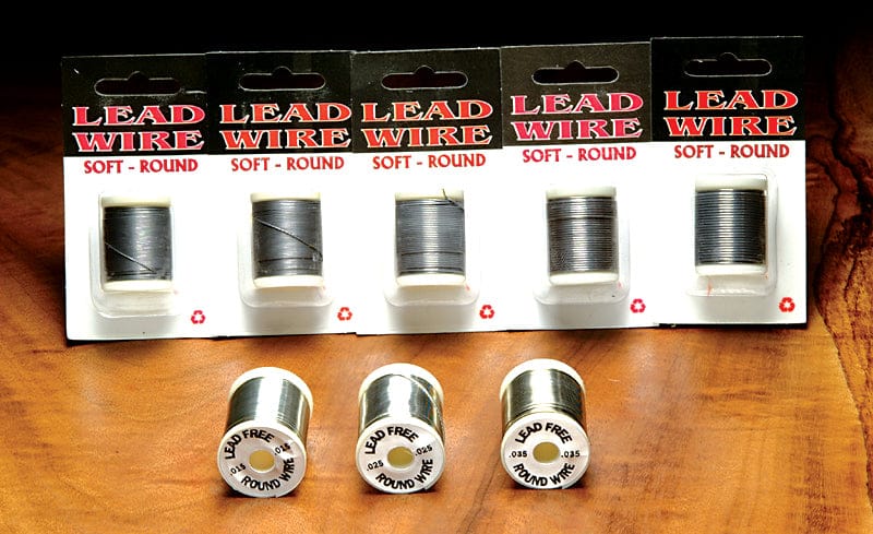 Danville spooled lead wire packs and loose silver-gray round soft wire spools for fly tying