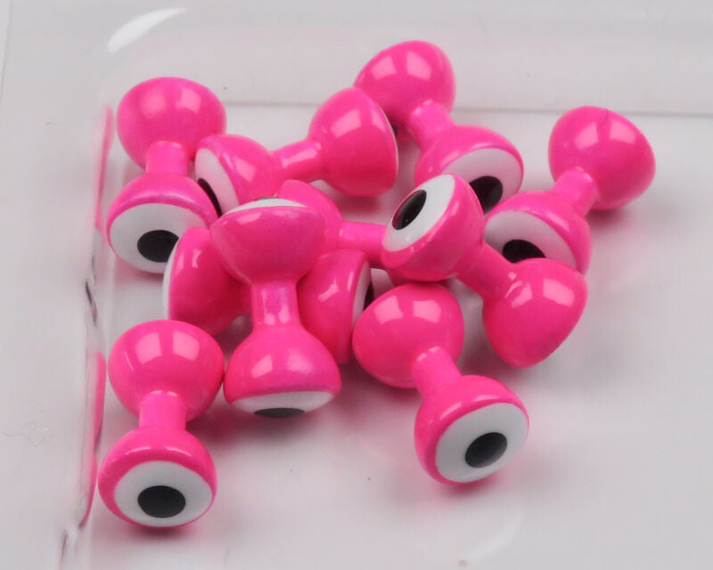 Bright hot-pink double-pupil brass eyes with white rings and black centers, glossy finish, for fly tying lures