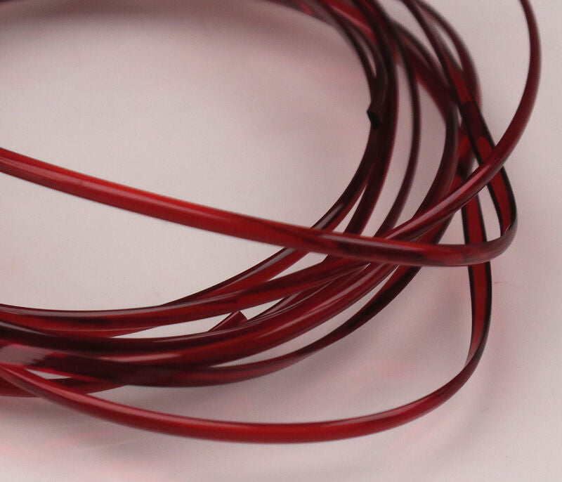 Coiled translucent deep red half-round D-rib plastic tubing for fly tying