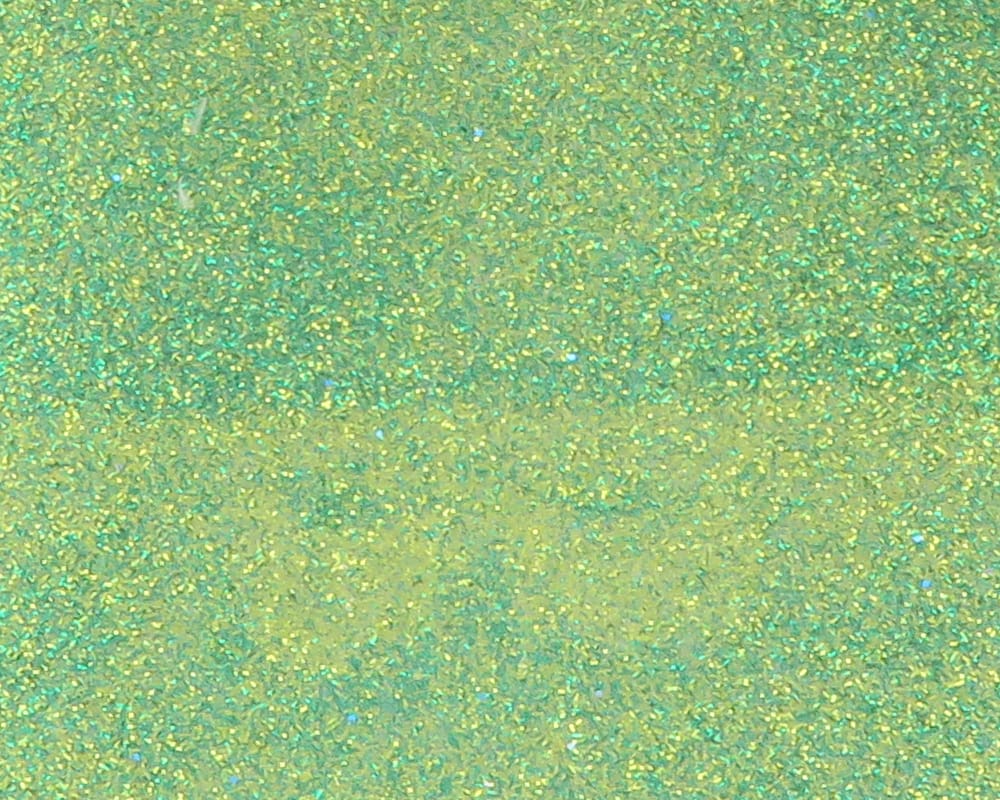 Green-gold iridescent crystal skin sheet with fine holographic flakes, sparkly fly tying material