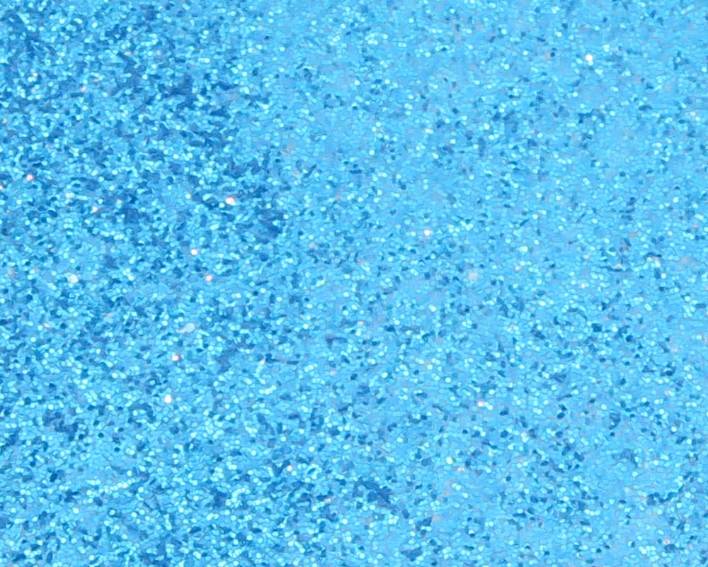 Aqua blue holographic crystal skin sheet with fine glitter flakes and reflective shimmer for fly tying