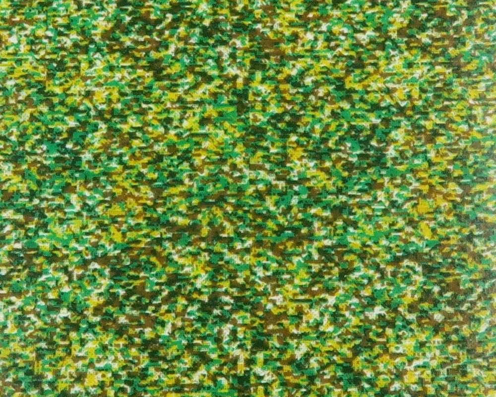 Green, yellow and brown mottled synthetic Fino skin with fine textured speckle pattern for fly tying
