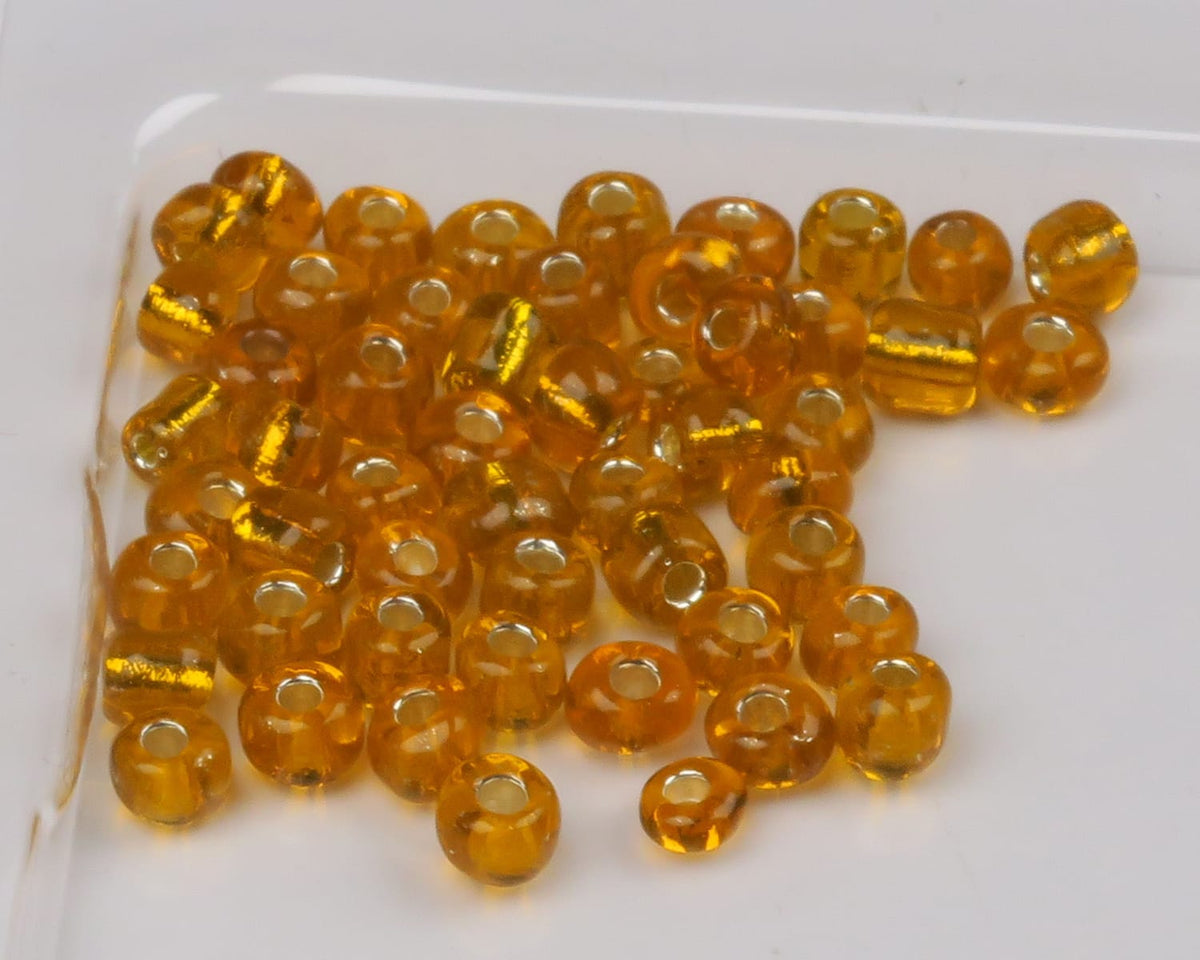 Amber translucent glass beads with silver-lined holes, round seed beads for fly tying