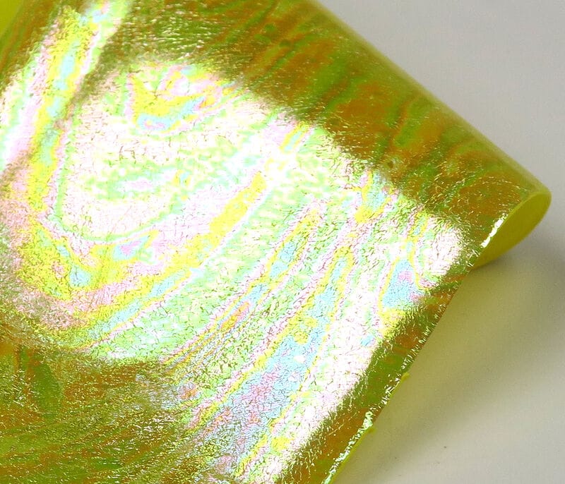 Iridescent lime-yellow UV Chewee skin with pearlescent rainbow sheen, reflective foil rolled edge for fly tying