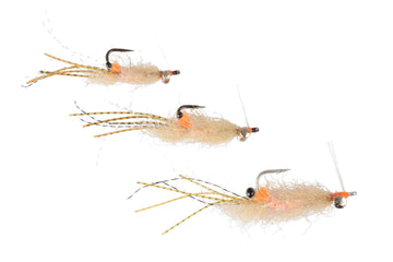 Beige spawning shrimp fly with fuzzy body, orange head accents, silver bead and striped yellow legs