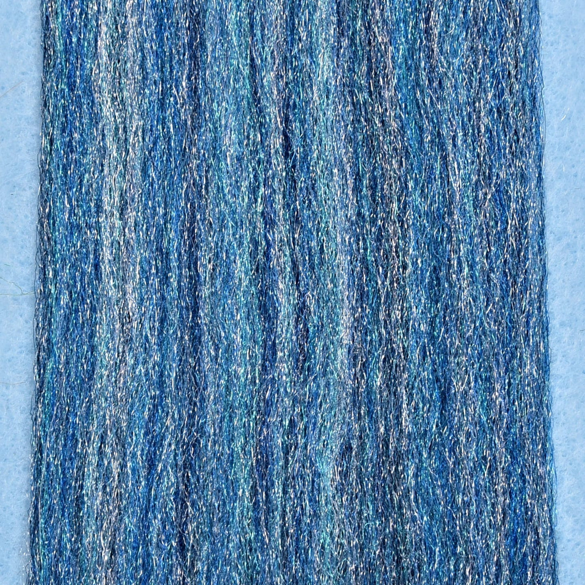Variegated shimmering blue Enrico Puglisi 3D fibers with metallic synthetic strands for fly tying