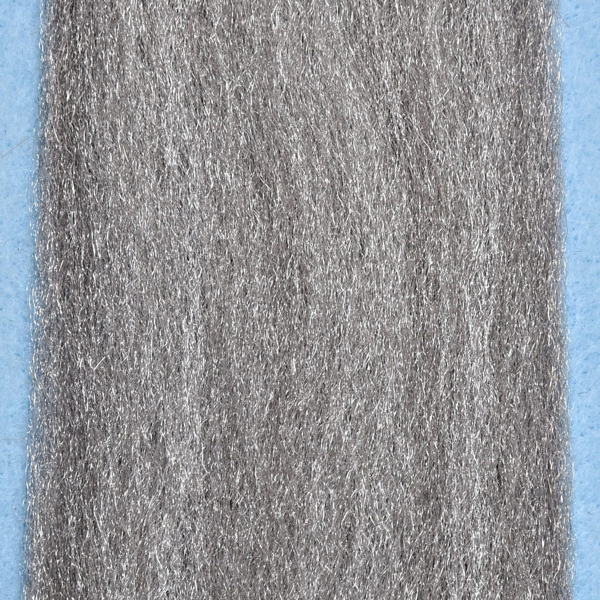 Silver-gray Enrico Puglisi 3D fly tying fibers, thin shiny synthetic strands with textured reflective finish
