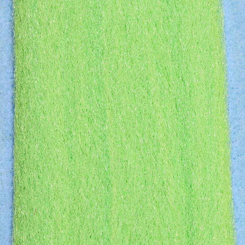 Chartreuse synthetic 3D fibers strip with fine shimmering texture for fly tying on light blue backing