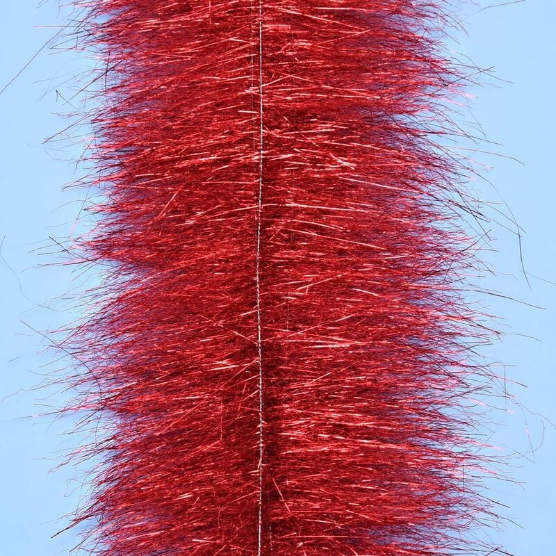 Red metallic Anadromus fly tying brush with dense synthetic shimmer fibers and stitched central spine
