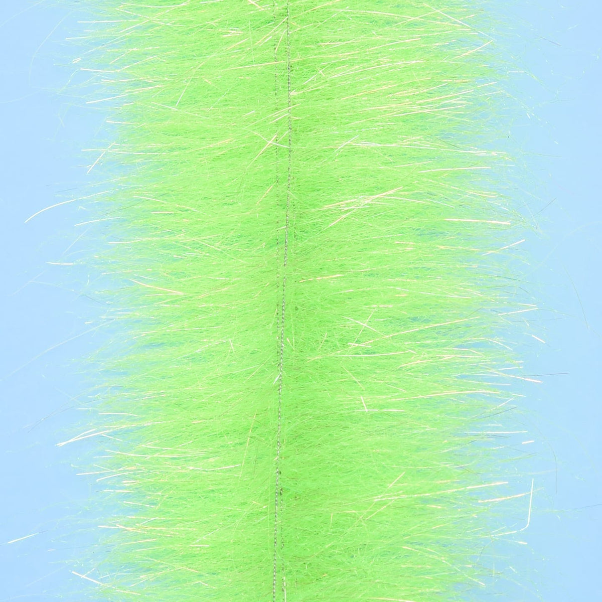 Chartreuse synthetic Anadromus brush strip with central stitched core and iridescent flash fibers for fly tying