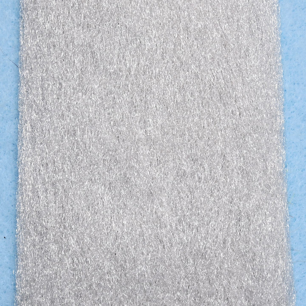 Silver synthetic EP fibers patch with fine shimmering strands and dense texture for fly tying