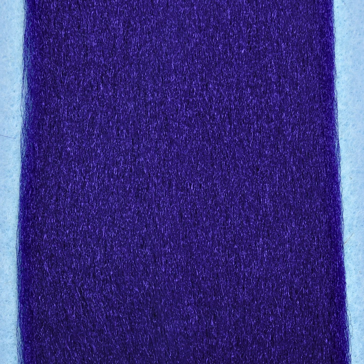 Deep purple synthetic EP Fibers for fly tying, fine shiny strands densely packed on pale backing