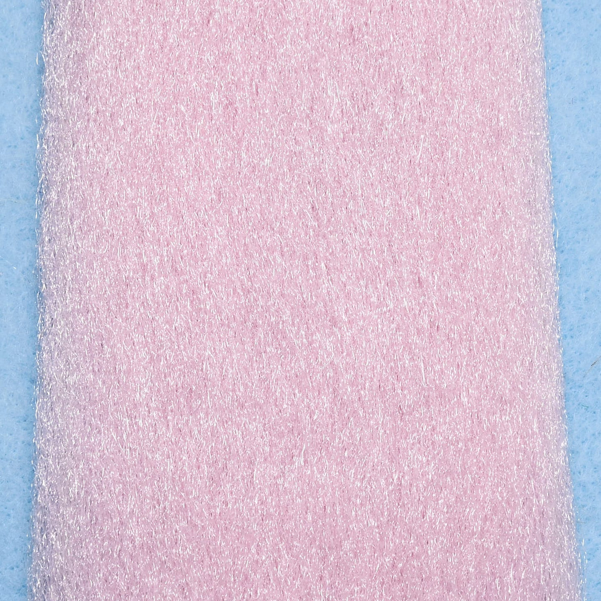Pale pink synthetic EP fibers with fine iridescent strands and brushed texture for fly tying