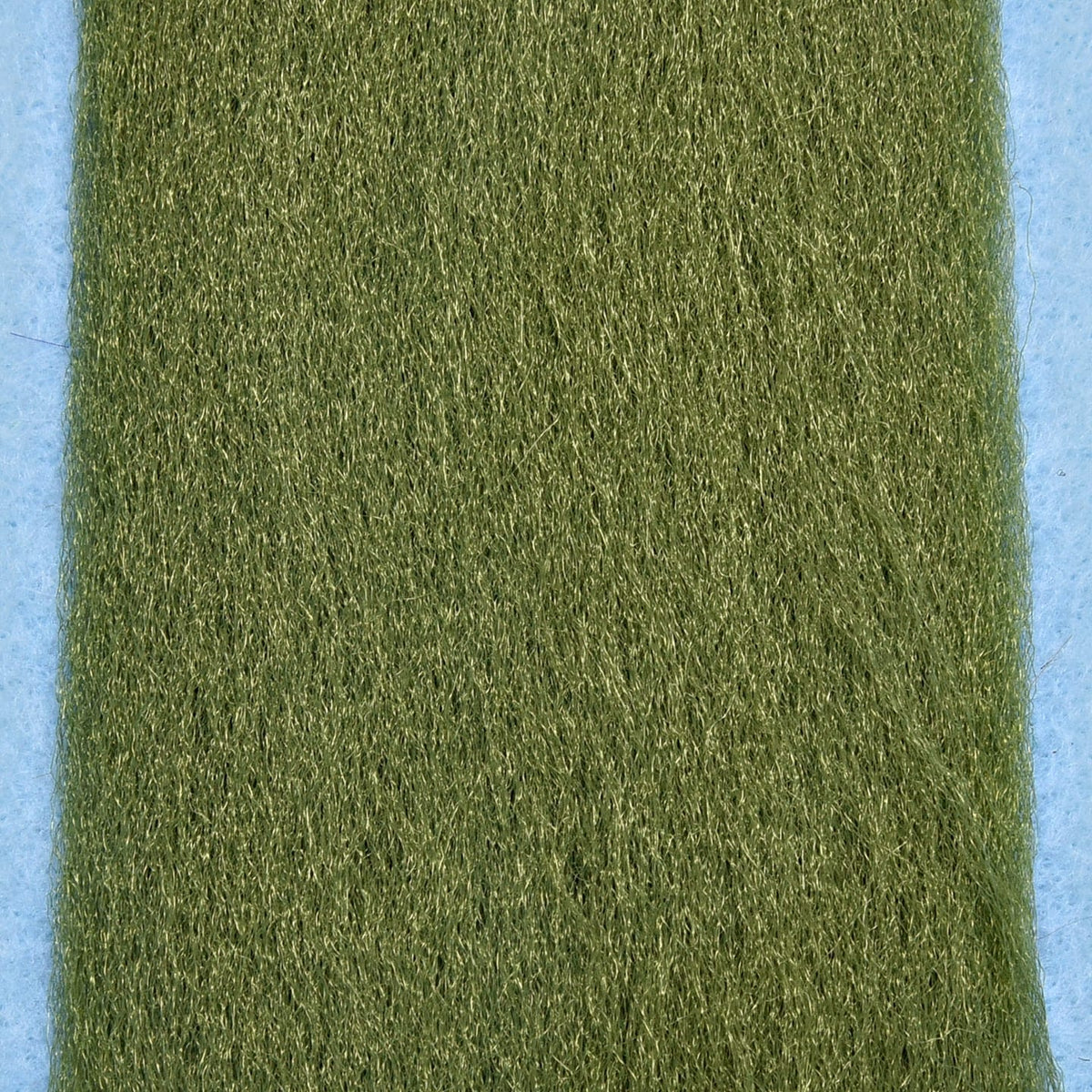 Olive green Enrico Puglisi EP Fibers synthetic fly tying fibers with fine hairy texture on blue background