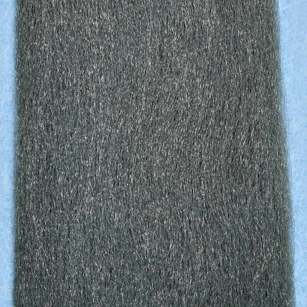 Enrico Puglisi EP Fibers dense ash-gray synthetic fly tying fibers, long slightly glossy strands on pale blue backing