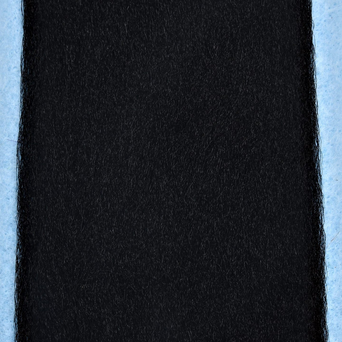 Black Enrico Puglisi EP Fibers sheet, dense synthetic hair fibers on blue backing, for fly tying