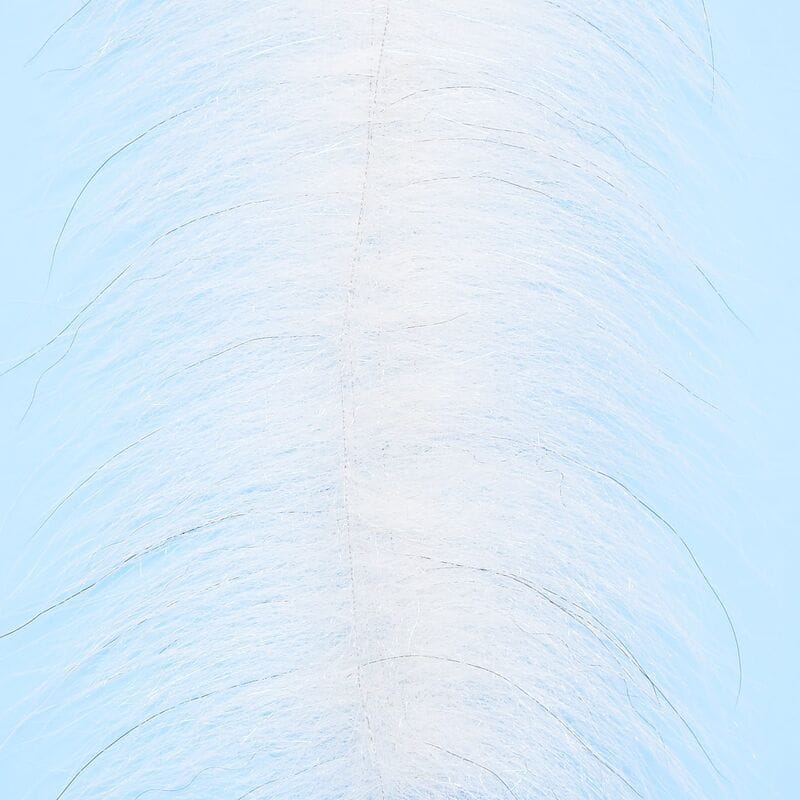 Enrico Puglisi Foxy Brush white synthetic fox fur streamer material for fly tying on pale blue background