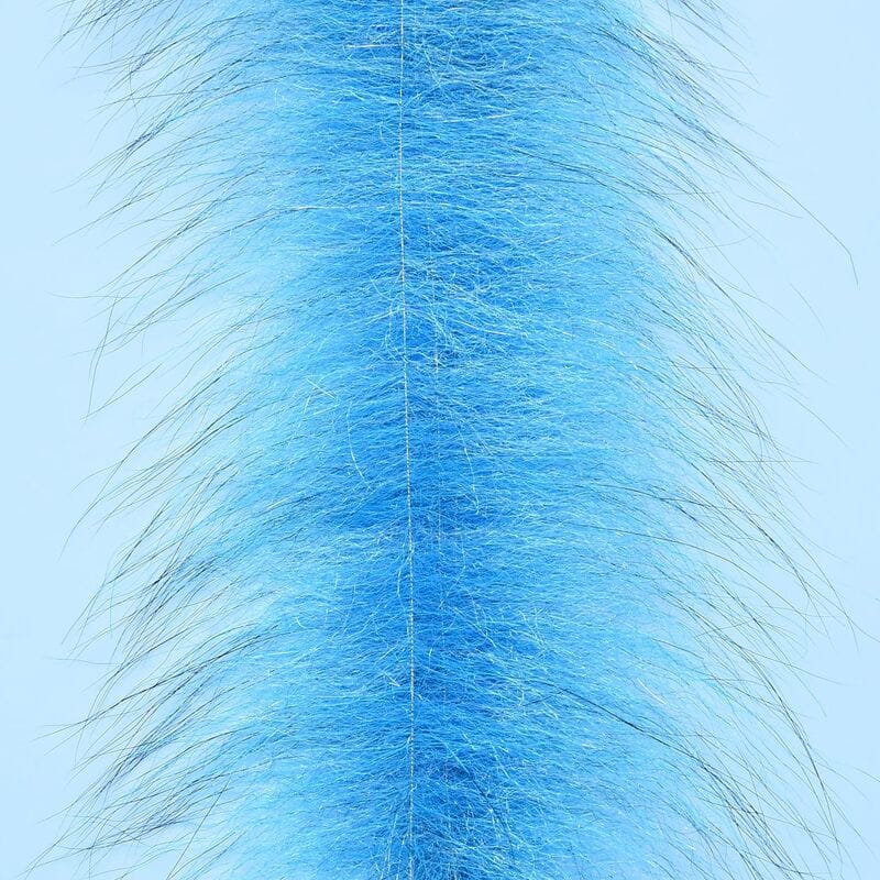 Bright blue Enrico Puglisi Foxy Brush strip with dense synthetic fur center and long wispy guard hairs for fly tying