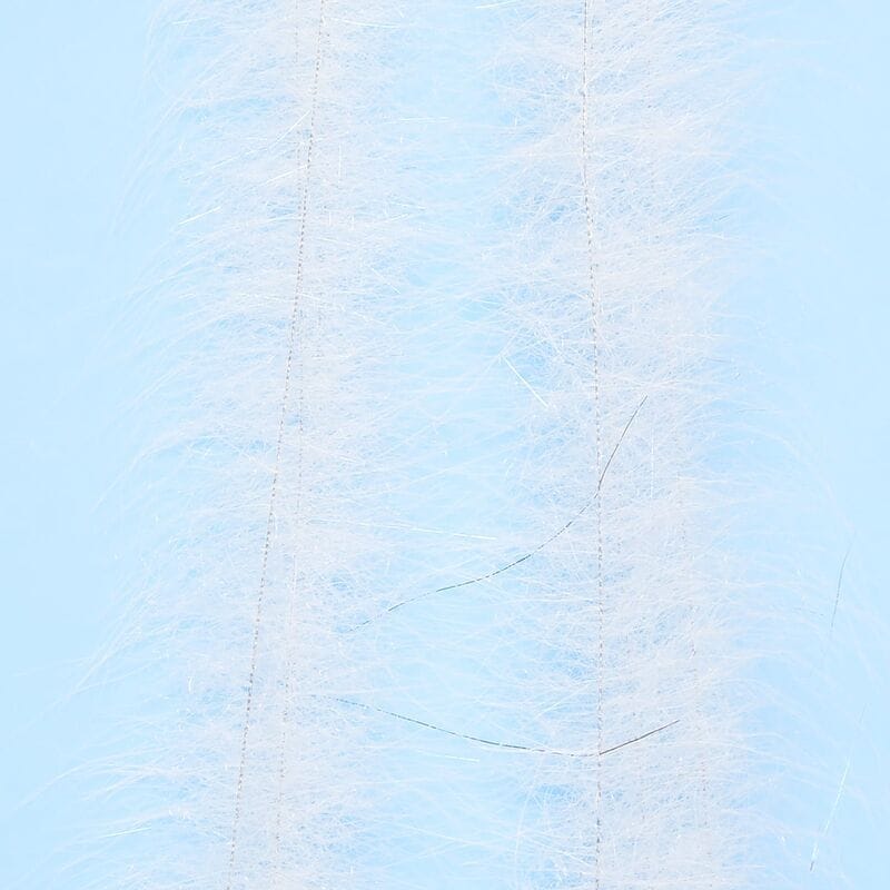 White Enrico Puglisi Foxy Brush synthetic hair strips with wispy fibers and subtle flash for fly tying, pale blue backdrop