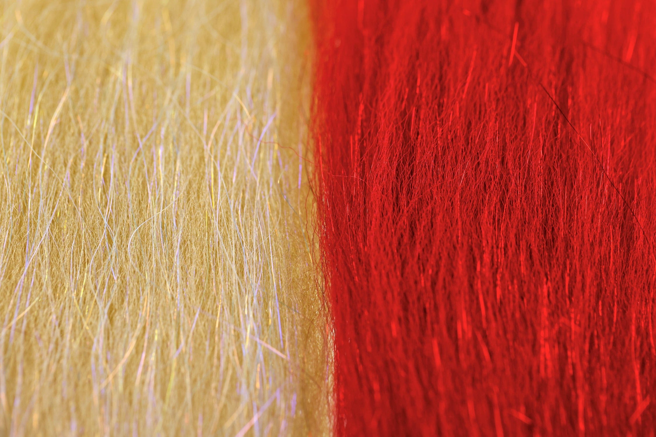 Close-up of Enrico Puglisi Sculpt-A-Fly synthetic fly-tying fibers in gold and vivid red, wispy iridescent strands