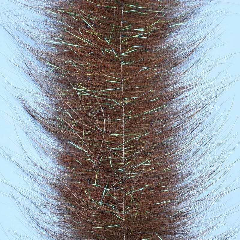 Brown Senyo chromatic brush with long soft synthetic fur fibers and green iridescent tinsel strands for fly tying