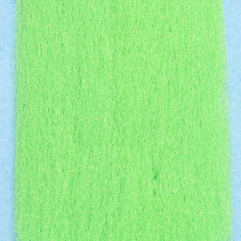 Bright chartreuse silky fibers for fly tying, soft synthetic strand sheet on pale blue backing