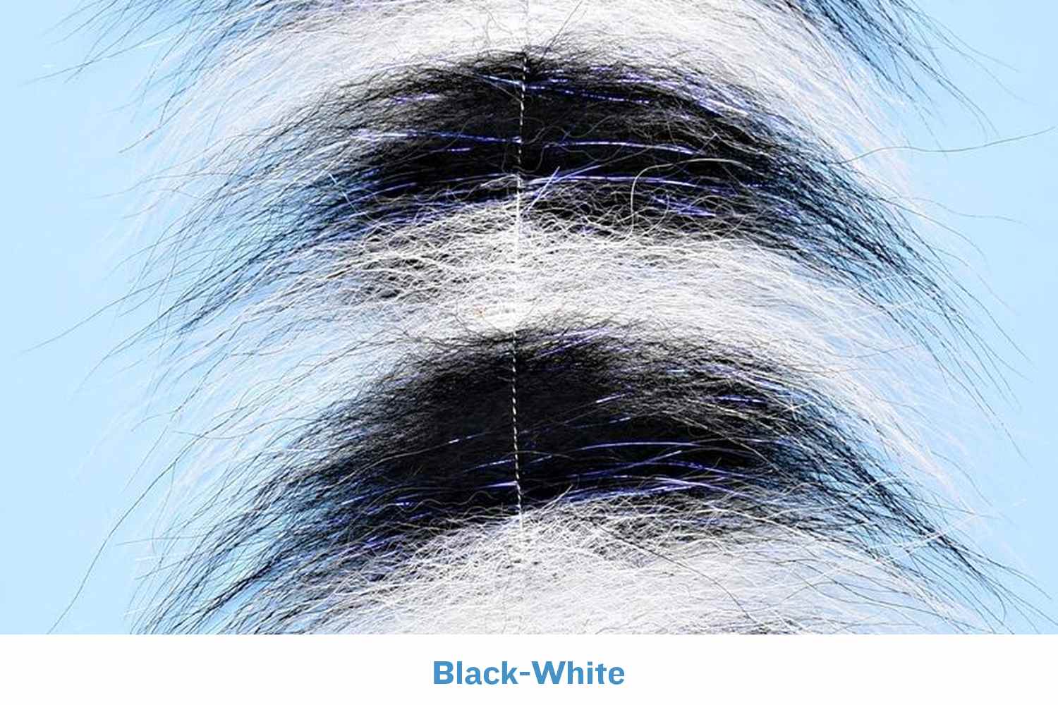 Black-and-white grizzly fox fur brush with long soft hairs, stitched center seam and subtle blue flash for fly tying