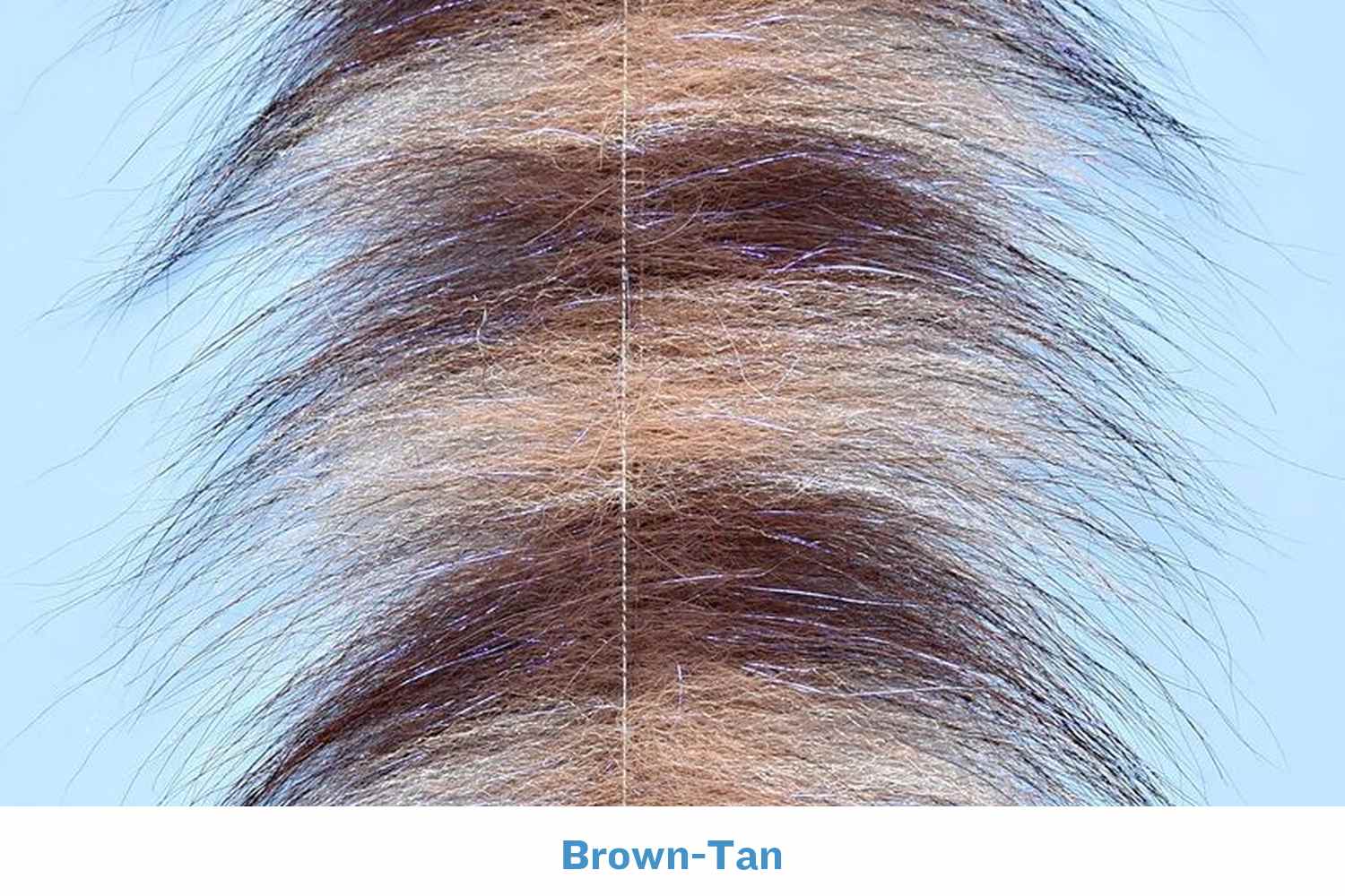 Brown-tan grizzly fox fur strip with long tapered fibers, center seam and subtle iridescent flash, fly tying material