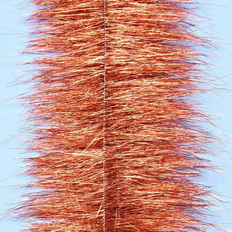 Enrico Puglisi copper sparkle brush with dense metallic orange tinsel fibers around central wire, fly tying material