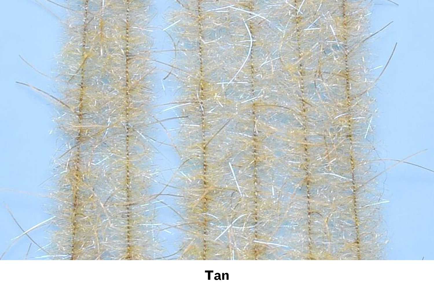 Tan Woolly Critter brush strands with fuzzy wool-like fibers and silver tinsel on wire cores for fly tying