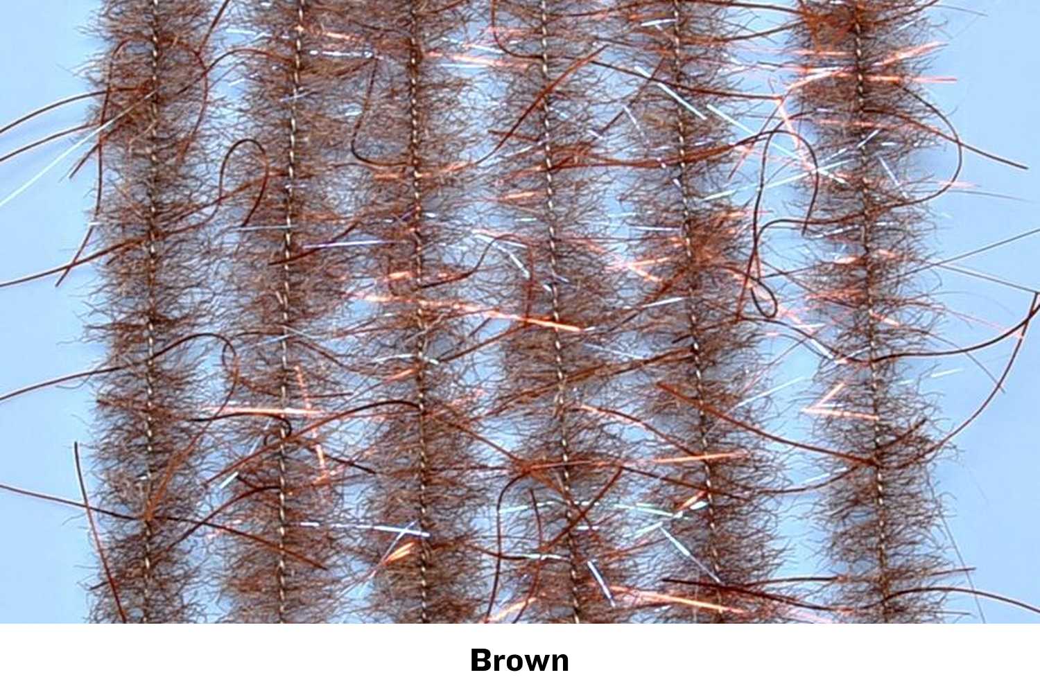 Brown Enrico Puglisi Woolly Critter brush strands with copper flash fibers for fly tying